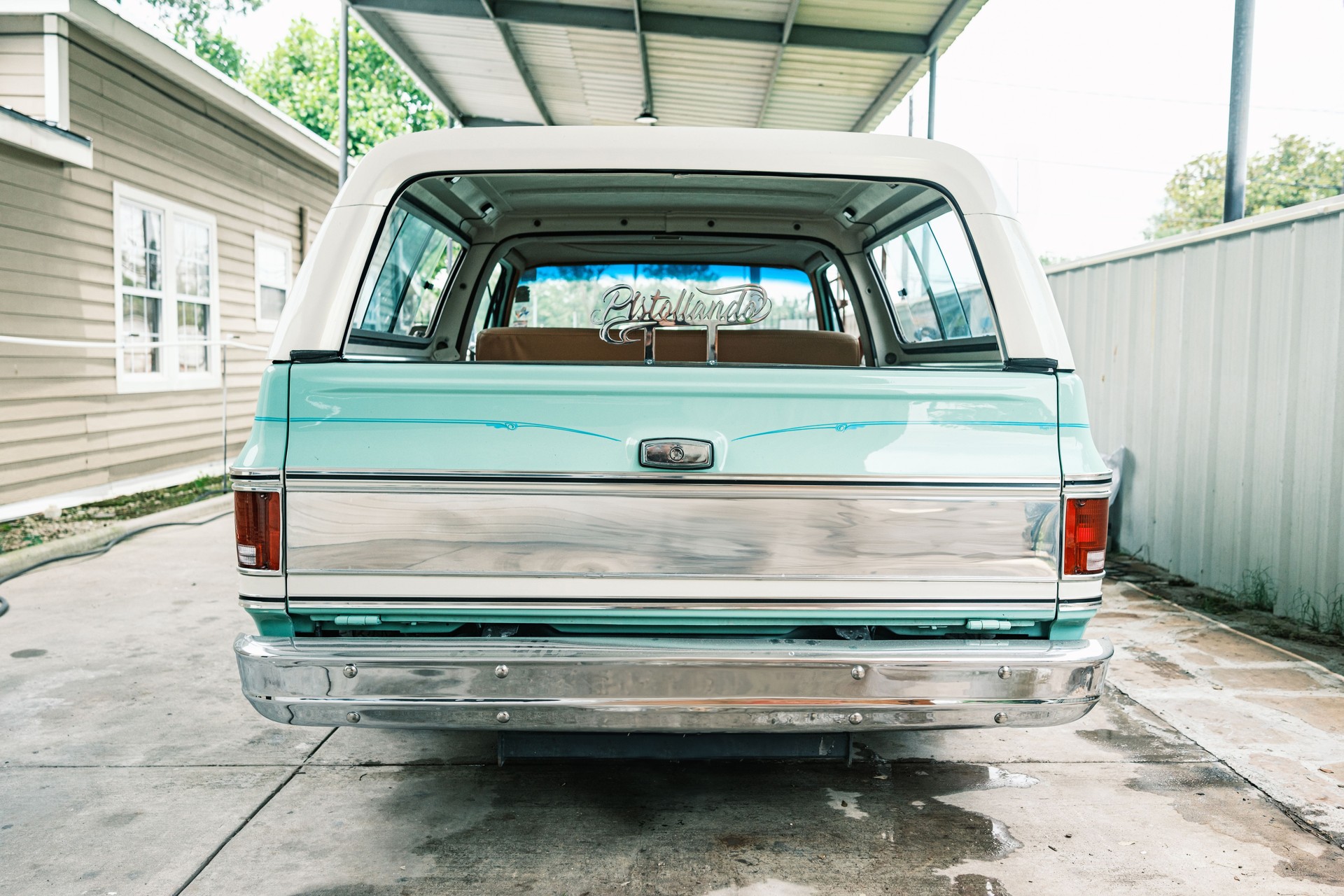 Vintage Low Rider SUV parked at the body shop